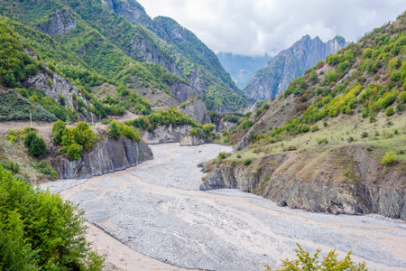 View over Lahich river bed torrent and vertical rocks in summer, Azerbaijan