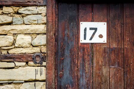House number 17 on the old style doorの写真素材