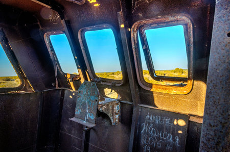 Old ships in the desert "ship cemetery" the consequence of Aral sea disaster, Muynak, Uzbekistanの写真素材