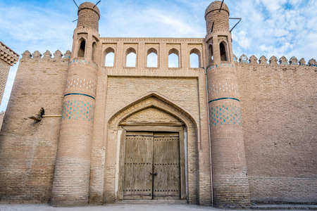 View to old door in the city wall in Khiva old town, Uzbekistanの写真素材