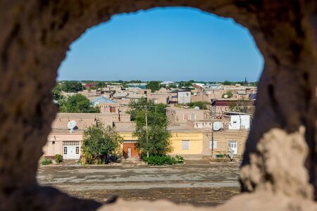 View over Khiva old town through city wall hole, Uzbekistanの写真素材