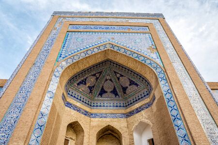 View to the arched old madrassa with blue patterns, Khiva old town, Uzbekistanの写真素材