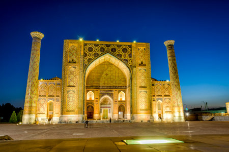 Illuminated Ulugh Beg Madrasah at night, Samarkand Registan, Uzbekistanのeditorial素材