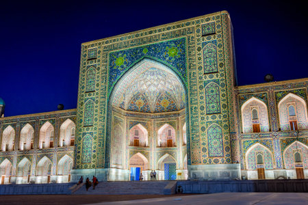 Illuminated Tilya-Kori madrasah at night, Samarkand Registan, Uzbekistanのeditorial素材