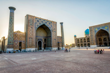 SAMARKAND, UZBEKISTAN - AUGUST 27: Visitors in front of Samarkand Registan in late afternoon. August 2016のeditorial素材
