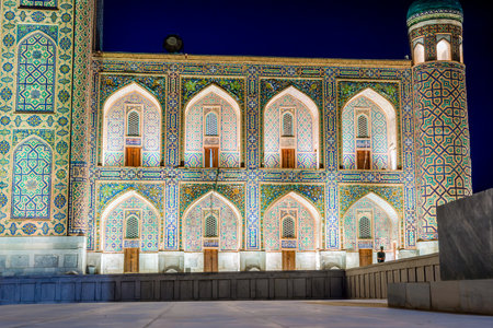 Illuminated Tilya-Kori madrasah at night, Samarkand Registan, Uzbekistanのeditorial素材