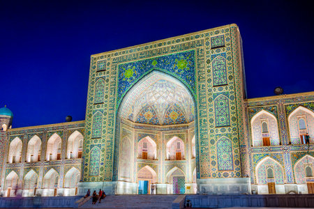 Illuminated Tilya-Kori madrasah at night, Samarkand Registan, Uzbekistanのeditorial素材