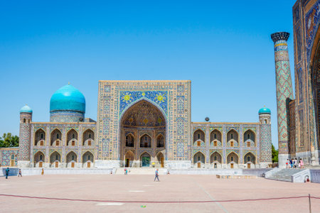 SAMARKAND, UZBEKISTAN - AUGUST 28: People walking in front of Registan mausoleum, famous landmark of Uzbekistan. Samarkand, august 2016のeditorial素材
