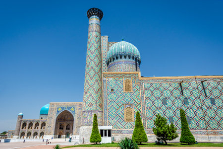 SAMARKAND, UZBEKISTAN - AUGUST 28: People walking in front of Registan mausoleum, famous landmark of Uzbekistan. Samarkand, august 2016のeditorial素材