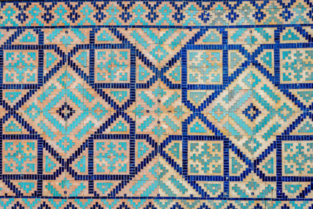 Colorful facade of mosaic and tiles of Registan mausoleum, Samarkand, Uzbekistanの写真素材