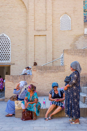 SAMARKAND, UZBEKISTAN - AUGUST 28: Women sitting on the stairs in front of Shah i Zinda mausoleum in Samarkand. August 2016のeditorial素材