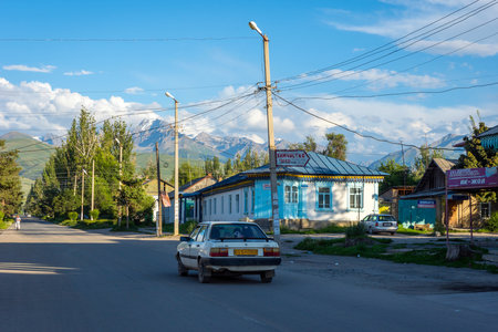 KARAKOL, KYRGYZSTAN - AUGUST 2: View over the street with cars and shops in Karakol city. August, 2016 のeditorial素材