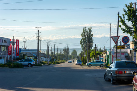 KARAKOL, KYRGYZSTAN - AUGUST 2: View over the street with cars and shops in Karakol city. August, 2016 のeditorial素材