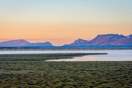 Song Kul lake in mist in early morning light, Kyrgyzstanの写真素材