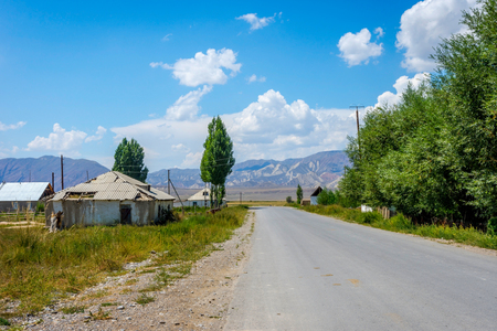Local road thur kyrgyz village of Ugut, Kyrgyzstanの写真素材