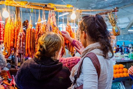 KUTAISI, GEORGIA - OCTOBER 22: Traditional Georgian churchkhela made of nuts and dried fruits dipped into fruit juice for sale at the local market in Kutaisi. October 2016のeditorial素材