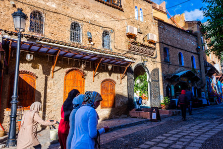 Chefchaouen, MOROCCO - DECEMBER 8: People walking on the street in Chefchaouen city famous of blue color. December 2016のeditorial素材