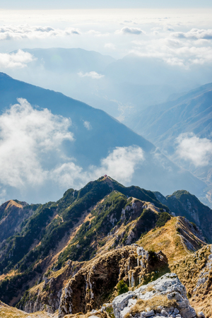 Via ferrata over the sea of clouds to bivouac Dino above Udine. The Alps, Italyの写真素材