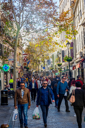 GIBRALTAR - NOVEMBER 19: People walking on the street in Gibraltar downtown on a sunny day. November 2016のeditorial素材