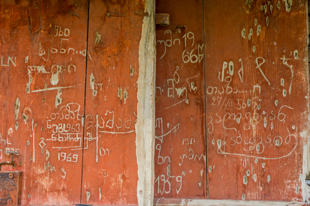 Carved door of the church with signatures in Georgian, Tushetiの写真素材