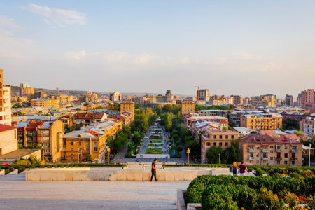 YEREVAN, ARMENIA - AUGUST 4: View over cascade stairs and Tamanyan park, with Yerevan skyline,...