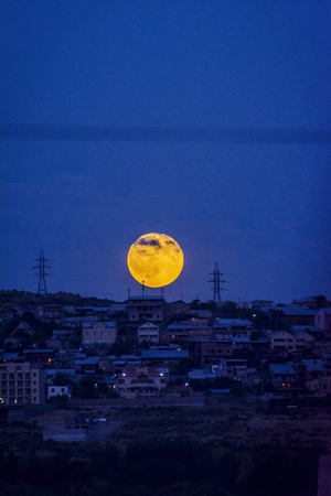 Full moon rising over Yerevan, Armeniaの写真素材