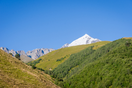 Scenic mountains and high snow peaks surrounding Mestia, Svaneti, Georgiaの写真素材
