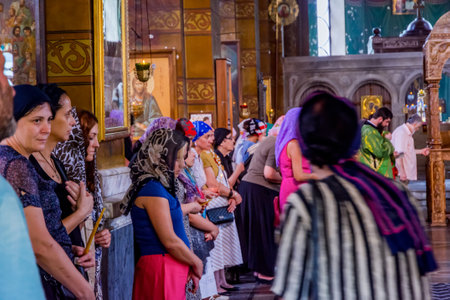 Batumi, Georgia - August 27, 2017: Women standing in religious ceremony in Holy Mother Virgin Nativity Cathedral in Batumiのeditorial素材