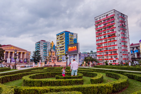 Batumi, Georgia - August 25, 2017: Family playing in Europe square garden in Batumi in late afternoon.のeditorial素材