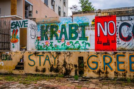 Krabi, Thailand - Sep 28: Wall full of Graffiti asking to stay green, Thailandのeditorial素材