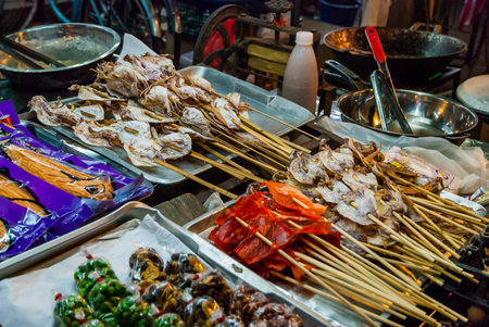 Food on the sticks ready to eat at the night market, Thailandのeditorial素材