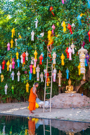 Chiang Mai, Thailand - Nov 2015: Buddhist monk preparing space in the temple for the celebration of...