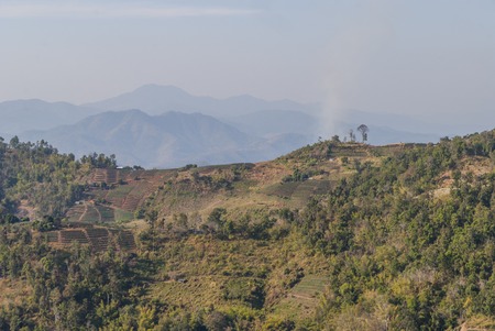 The view over hills and terraces in northern Thailand around Chiang Maiの写真素材