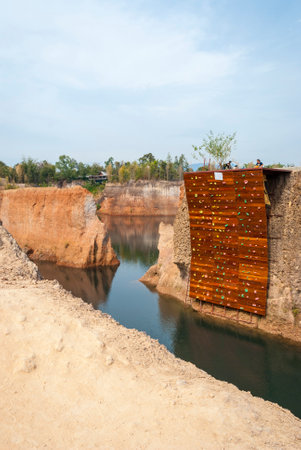 Climbing wall for free climbing over water in Chiang Mai canyon, Thailandのeditorial素材