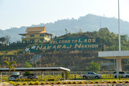 Nakaraj Nakhon, Laos - Feb 2016: Border crossing from Thailand to Lao at Chiang Khong-Huay Xai Friendship Bridge with big sign "Welcome to Laos"のeditorial素材