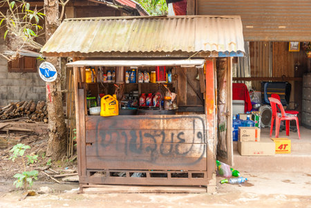 Luang Prabang, Laos - Feb 2016: Small local petrol station selling gasoline in bottlesのeditorial素材