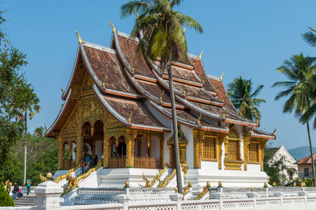 Luang Prabang, Laos - Feb 2016: people visiting Haw Pha Bang temple, one of the most important city's landmarksのeditorial素材