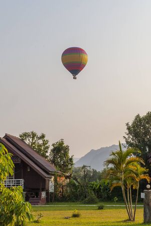 Hot air balloon flying over Vang Vieng, Laosの写真素材