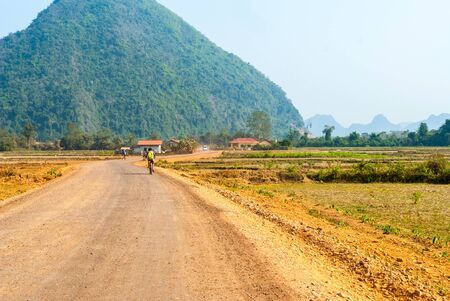 Dirt road thru the village, Laosの写真素材