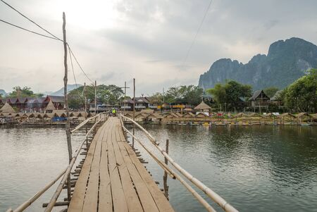 Wooden bridge over the river, Vang Viengの写真素材