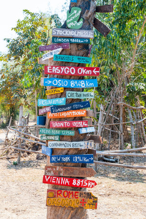 Sign with cities and distances from Laos
