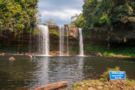 Paksong, Laos - Feb 2016: People swimming at Thamchamp Pee waterfall near Paksong, Laosのeditorial素材