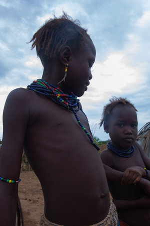 Omorate, Ethiopia - Nov 2018: Dasanech tribe kids playing in the village. Omo valley