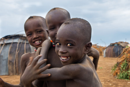 Omorate, Ethiopia - Nov 2018: Dasanech tribe kids playing in the village. Omo valleyのeditorial素材