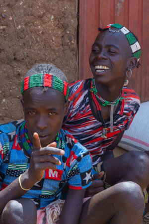 Turmi, Ethiopia - Nov 2018: Younger Hamer tribe men wearing traditional clothes. Omo valleyのeditorial素材