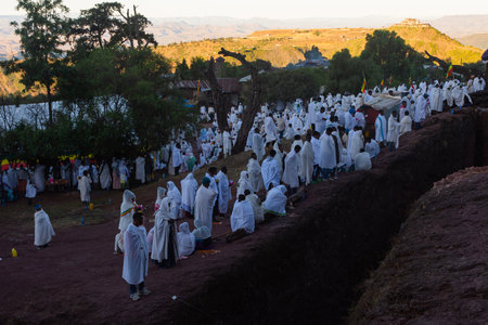 Lalibela, Ethiopia - Nov 2018: Pilgrims dressed in traditional ethiopian white colors gathering outside the Lalibela underground churches.のeditorial素材