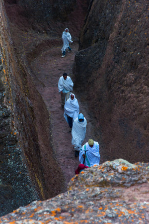 Lalibela, Ethiopia - Nov 2018: People walking in the tunnels at churches of Lalibela, which are excavated into rockのeditorial素材