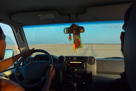 Driving over salt flats by 4x4 in Danakil desert, Ethiopiaの写真素材