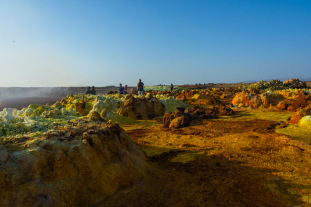 Dallol, Ethiopia - Nov 2018: Tourists passing thru colorful landscape of Dallol terrestrial hydrothermal system in Danakil desert, Ethiopiaのeditorial素材