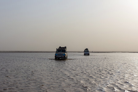 Dallol, Ethiopia - Nov 2018: Driving by 4x4 at Danakil depression salt lake, safari.のeditorial素材